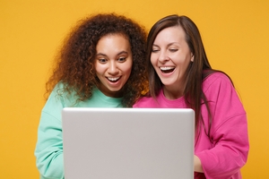 Two Friends Using Laptop